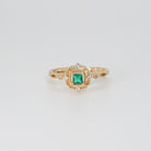 St. Ann's Ring: Shimmering stones encasing a striking square-shaped green centerpiece, epitome of sophistication.