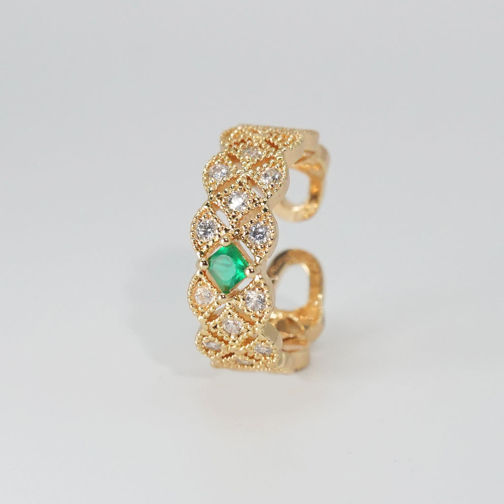 Jasmine Ring: Shimmering stones encircling a captivating green centerpiece, epitome of elegance.