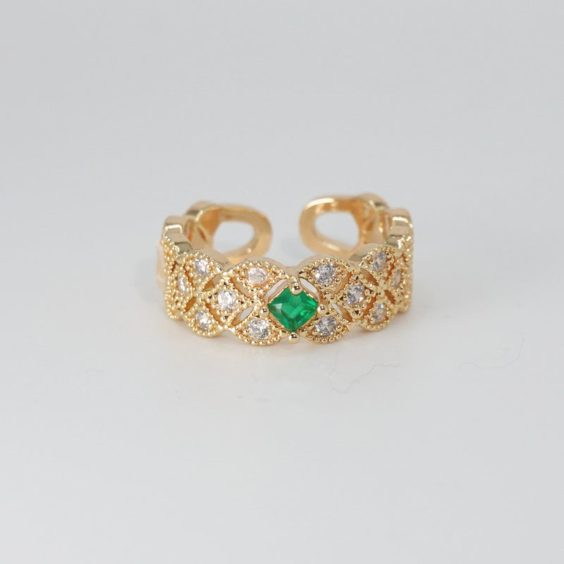 Jasmine Ring: Shimmering stones encircling a captivating green centerpiece, epitome of elegance.