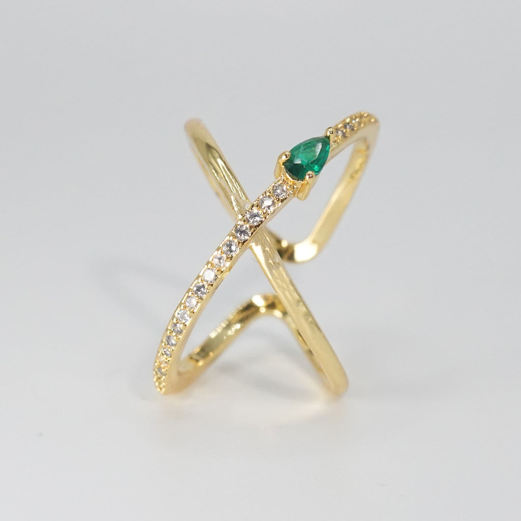 Agate Ring: Cross-shaped design with shiny stones and a prominent green centerpiece, epitome of sophistication.