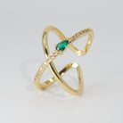 Agate Ring: Cross-shaped design with shiny stones and a prominent green centerpiece, epitome of sophistication.