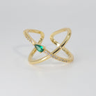 Agate Ring: Cross-shaped design with shiny stones and a prominent green centerpiece, epitome of sophistication.