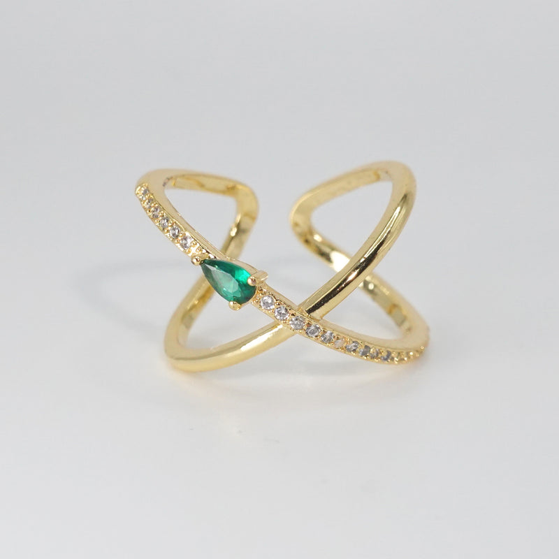 Agate Ring: Cross-shaped design with shiny stones and a prominent green centerpiece, epitome of sophistication.