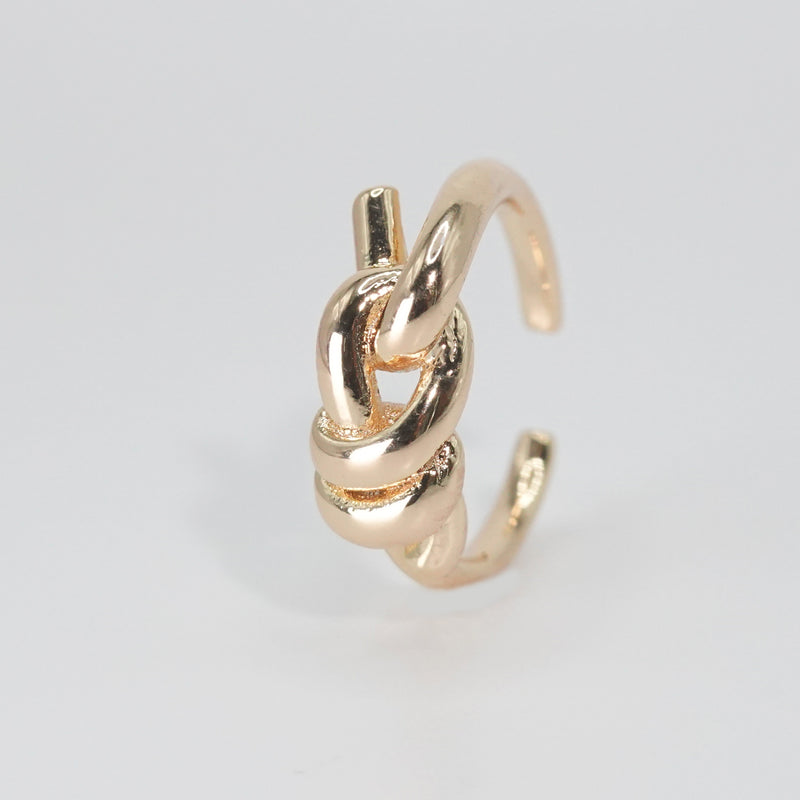 Lily Ring: Graceful knot design symbolizing timeless elegance, a sophisticated accessory.