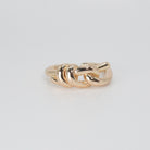 Lily Ring: Graceful knot design symbolizing timeless elegance, a sophisticated accessory.