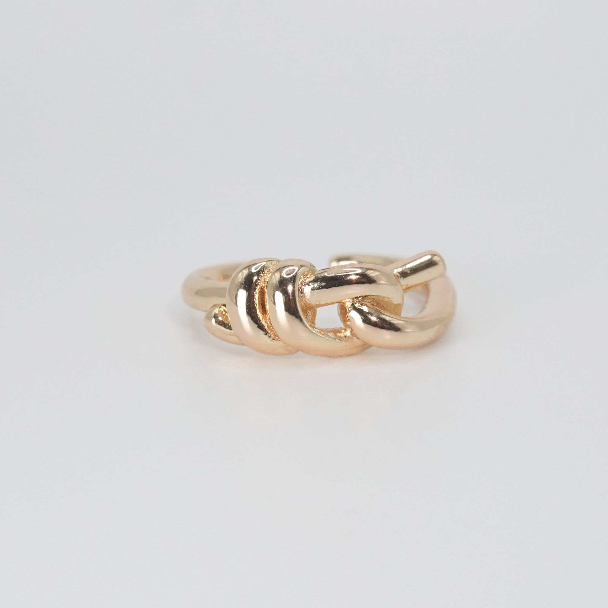 Lily Ring: Graceful knot design symbolizing timeless elegance, a sophisticated accessory.