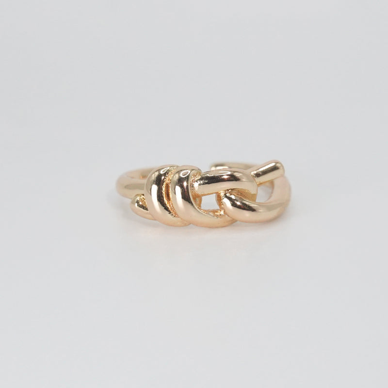Lily Ring: Graceful knot design symbolizing timeless elegance, a sophisticated accessory.