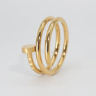Garnet Ring: Striking nail-shaped design, adding edgy glamour to any outfit.