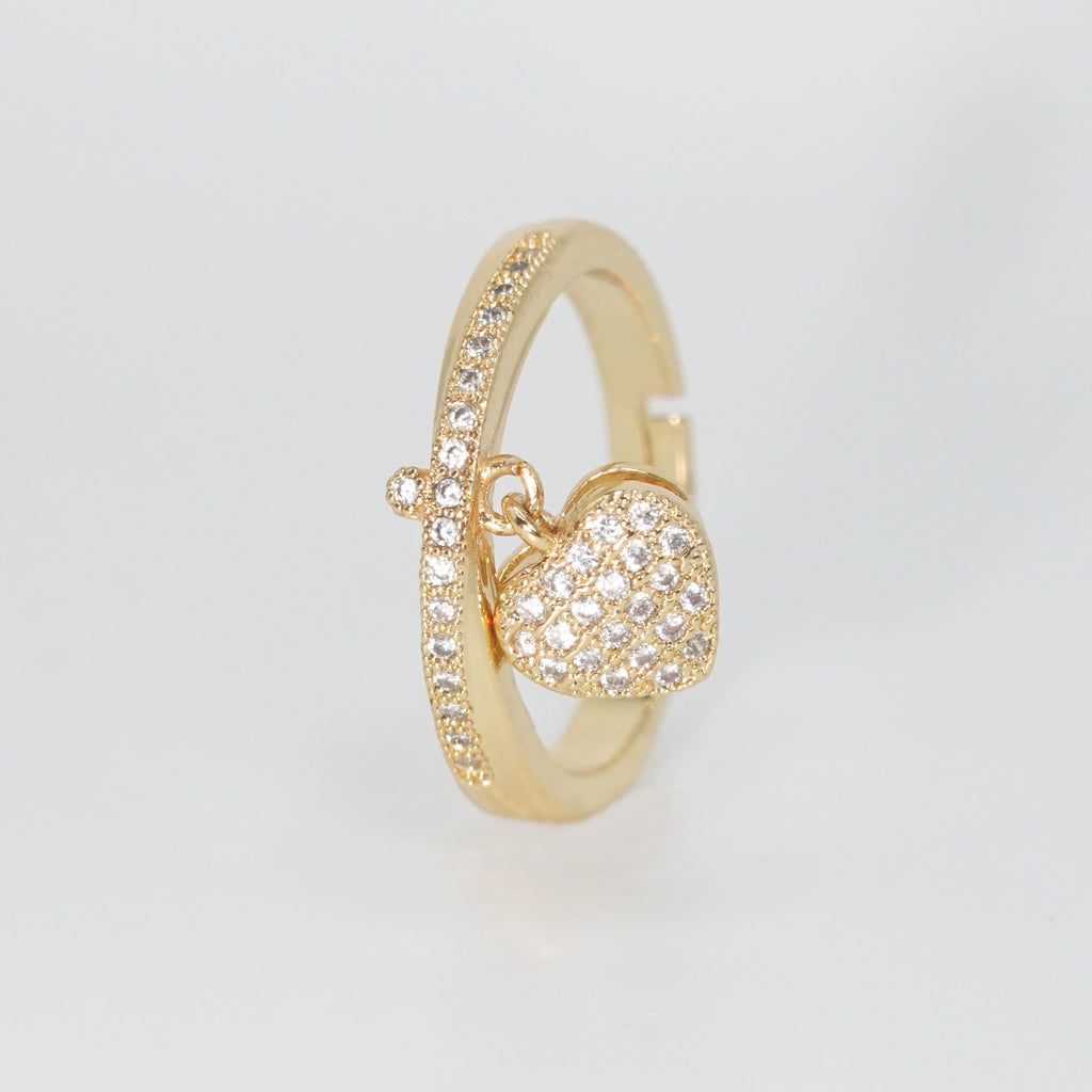 Le Doux Ring - Enchanting accessory with attached heart charm.