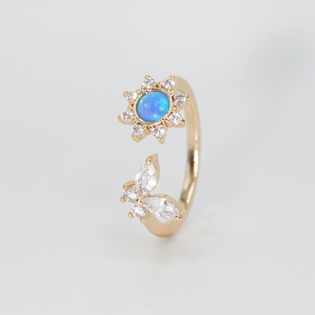 Sweetwater Ring - Opal centerpiece with butterfly and shimmering stones.