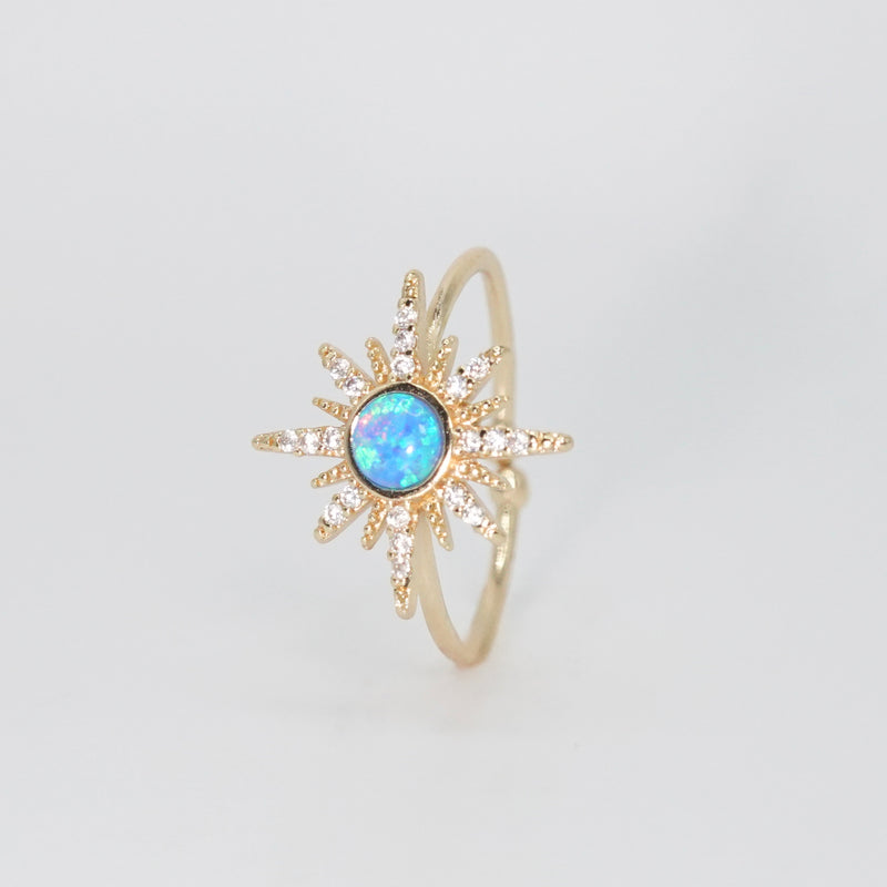 Cavalleri Ring - Opal center surrounded by a star motif in silver.