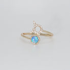 Taurus Ring: Bull symbol with shimmering stones surrounding an opal, epitome of stability.