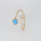 Pisces Ring: Fish symbol with shimmering stones surrounding an opal, epitome of creativity.