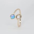 Cancer Ring: Crab symbol with shimmering stones surrounding an opal, embodying emotional depth.