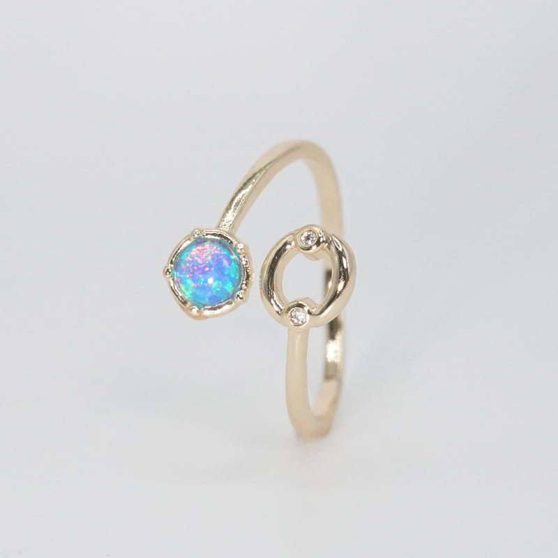 Cancer Ring: Crab symbol with shimmering stones surrounding an opal, embodying emotional depth.