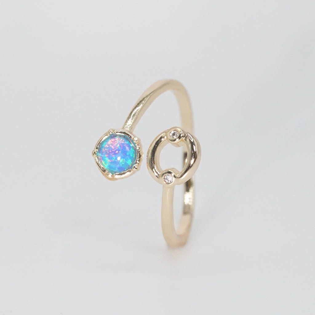 Cancer Ring: Crab symbol with shimmering stones surrounding an opal, embodying emotional depth.