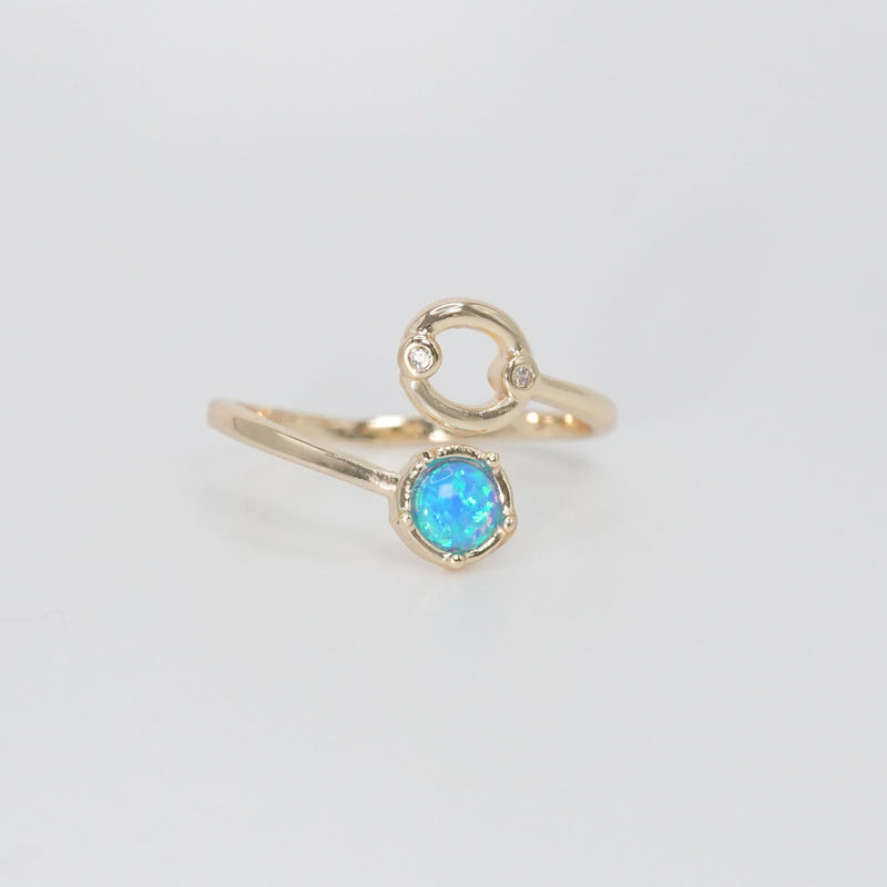 Cancer Ring: Crab symbol with shimmering stones surrounding an opal, embodying emotional depth.