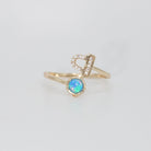  Libra Ring: Scales symbol with shimmering stones surrounding an opal, epitome of balance.