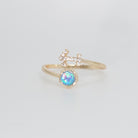 Sagittarius Ring: Archer symbol with shimmering stones surrounding an opal, epitome of adventure.