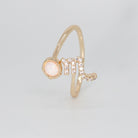 Scorpio Ring: Scorpion symbol with shimmering stones surrounding an opal, epitome of intensity.