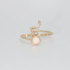 Scorpio Ring: Scorpion symbol with shimmering stones surrounding an opal, epitome of intensity.