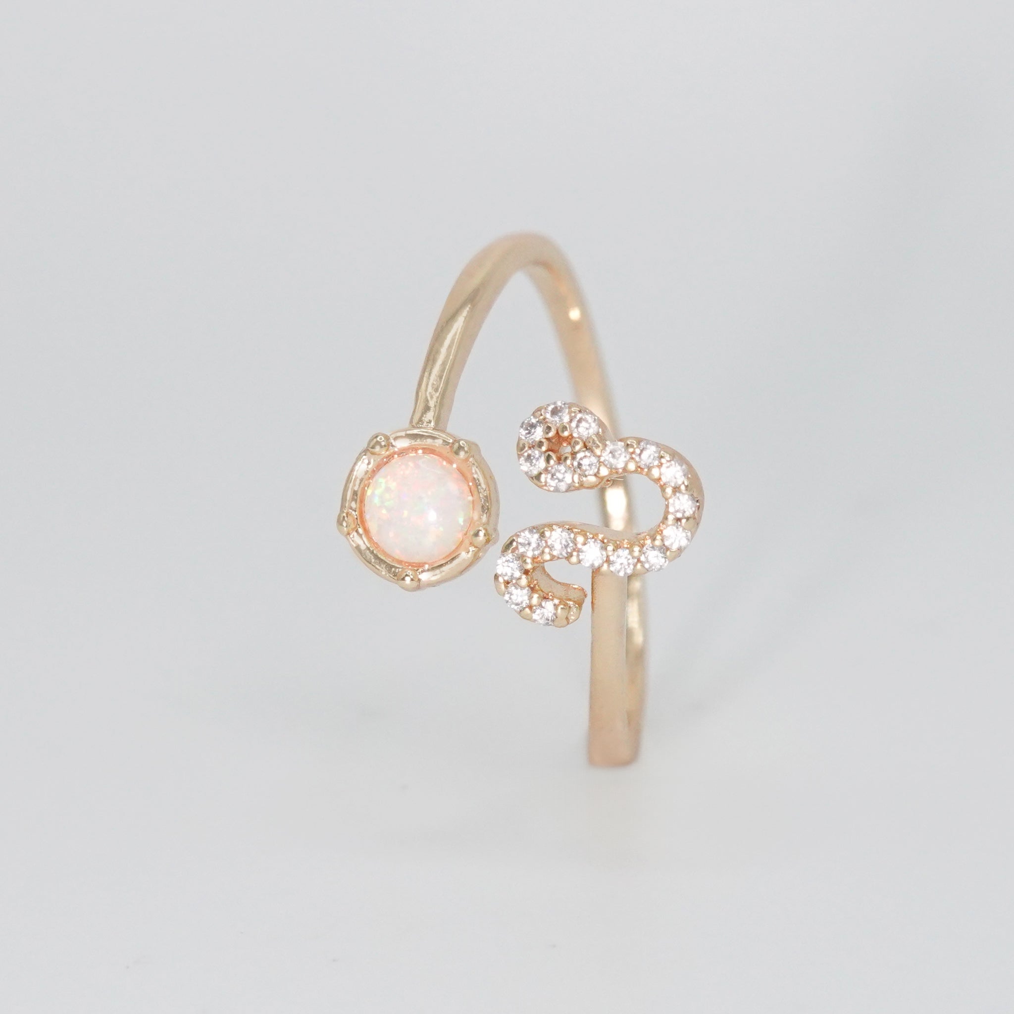 Leo Ring: Lion symbol with shimmering stones surrounding an opal, epitome of confidence.