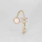 Pisces Ring: Fish symbol with shimmering stones surrounding an opal, epitome of creativity.