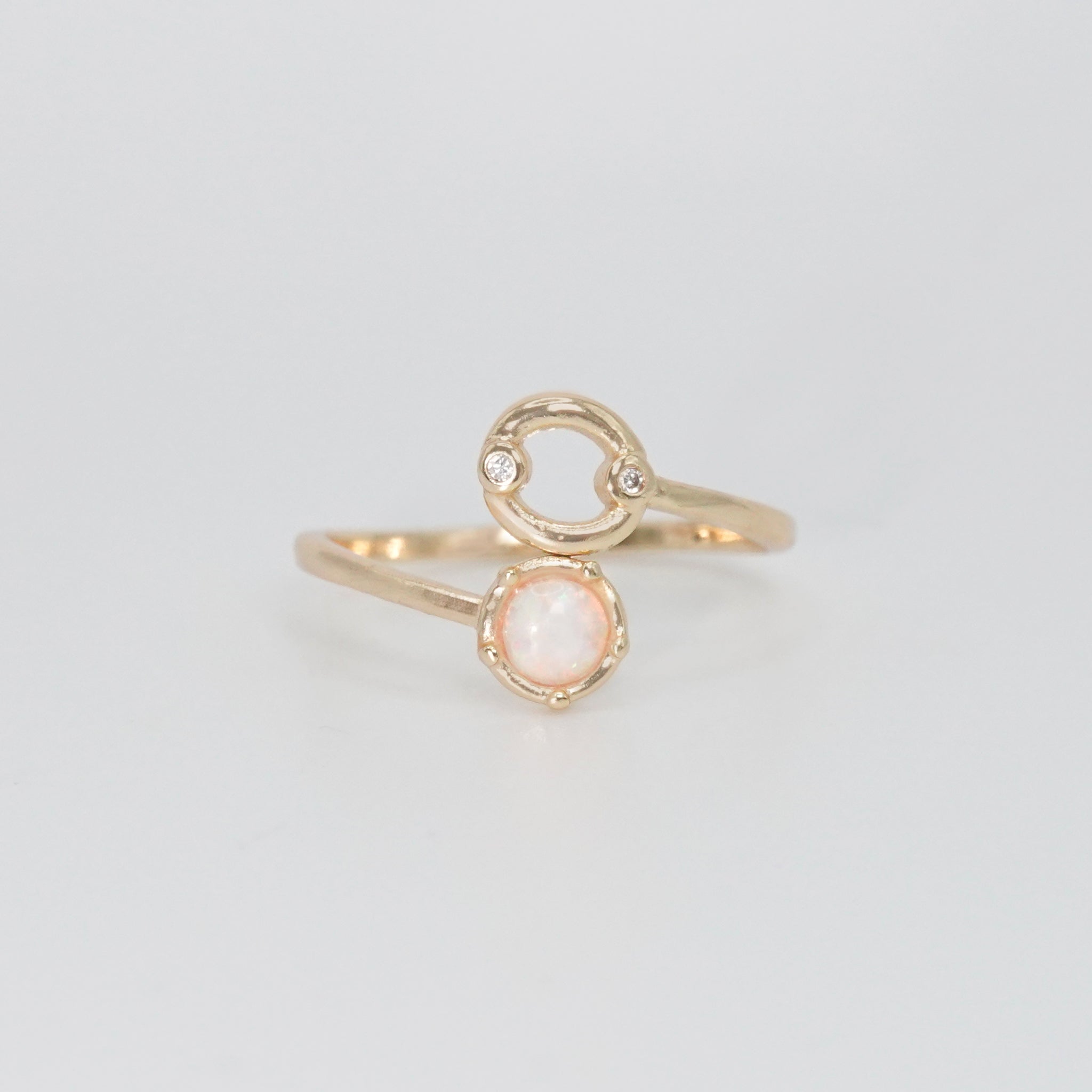 Cancer Ring: Crab symbol with shimmering stones surrounding an opal, embodying emotional depth.