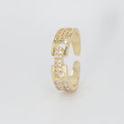 Baylor Ring: Two intricately connected pieces adorned with shimmering stones, exuding elegance and sophistication.