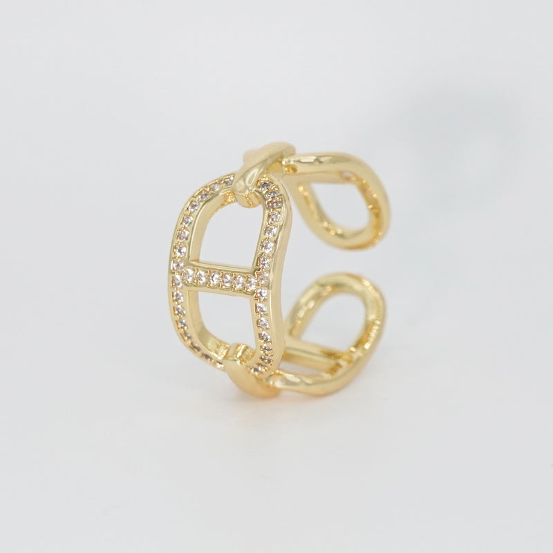 Mabery Ring: Adorned with dazzling shiny stones, exuding elegance and sparkle.
