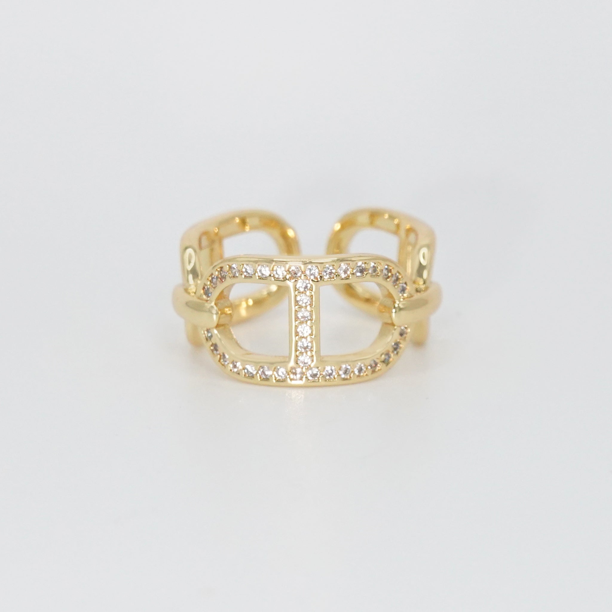 Mabery Ring: Adorned with dazzling shiny stones, exuding elegance and sparkle.