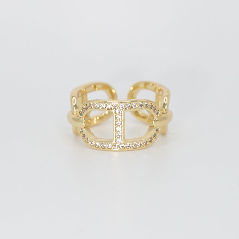 Mabery Ring: Adorned with dazzling shiny stones, exuding elegance and sparkle.
