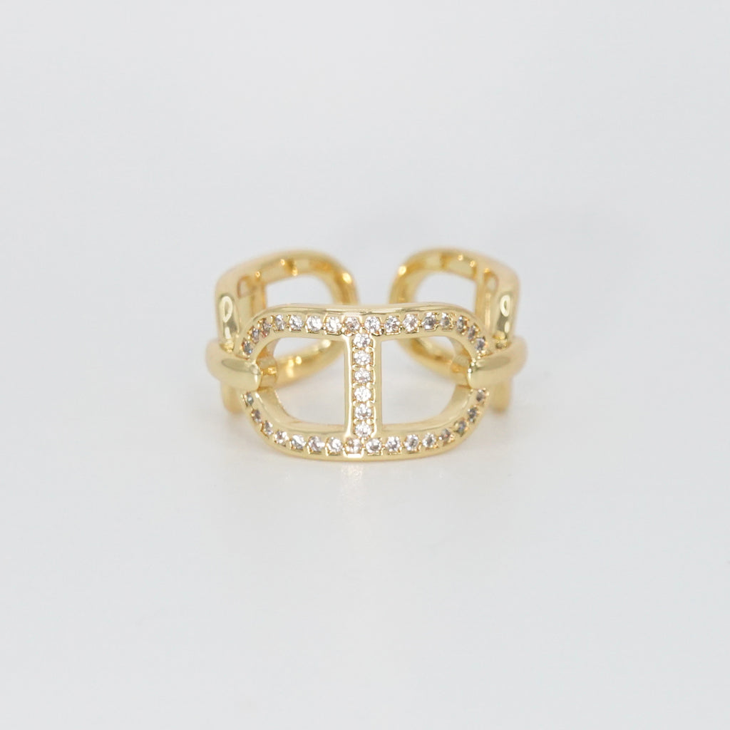 Mabery Ring: Adorned with dazzling shiny stones, exuding elegance and sparkle.