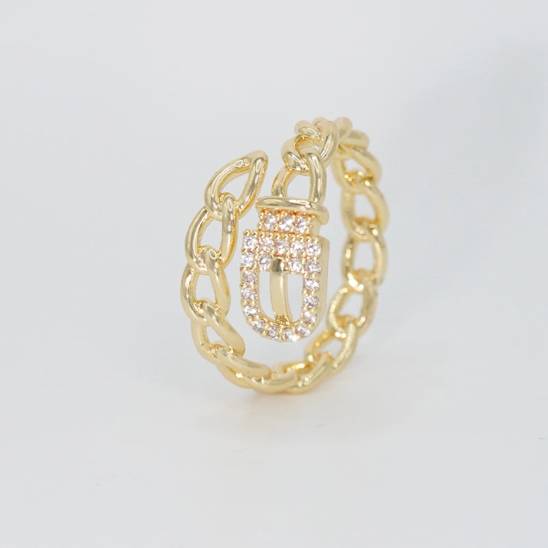  Radcliffe Ring: Chic chain and belt design adorned with dazzling stones, epitome of modern elegance.