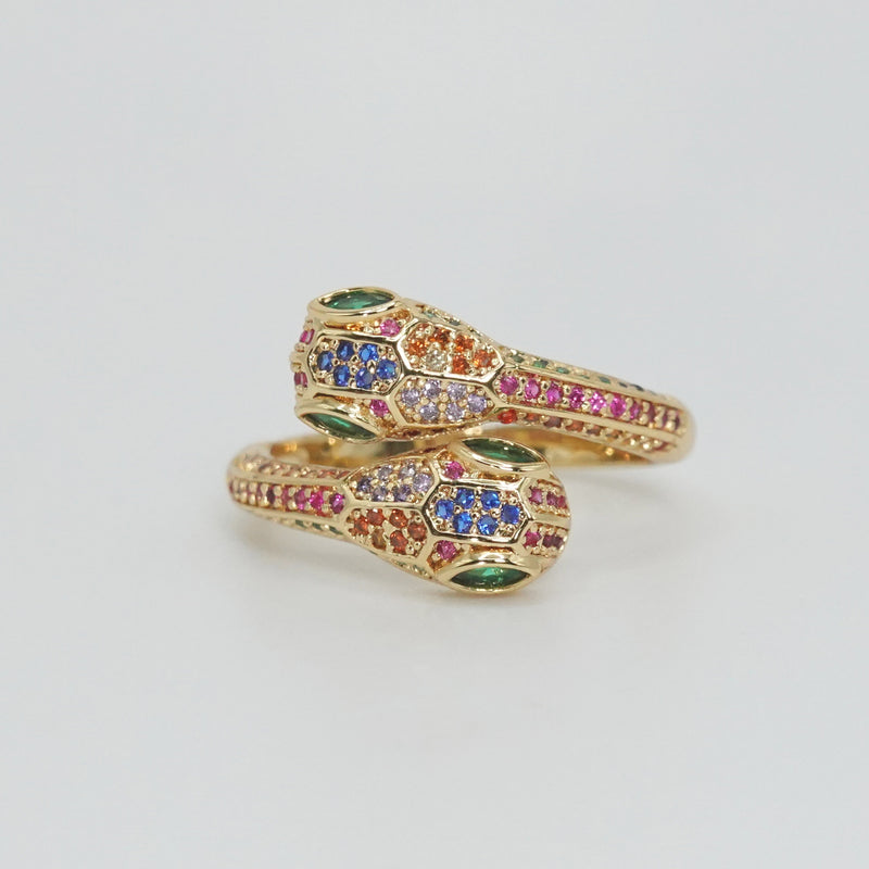 Twin serpents intertwined with shiny, colorful stones, exuding enchanting allure.