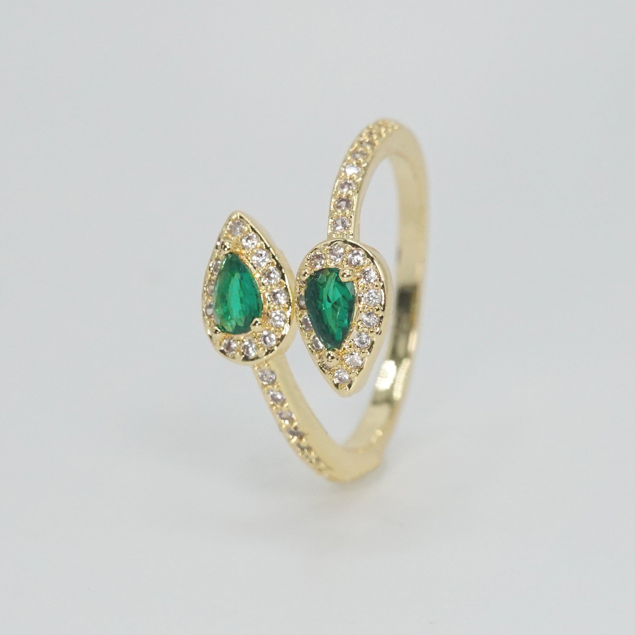 Old Topanga Ring: Twin serpents with captivating green stones at heads and shimmering stones along bodies, epitome of timeless sophistication.