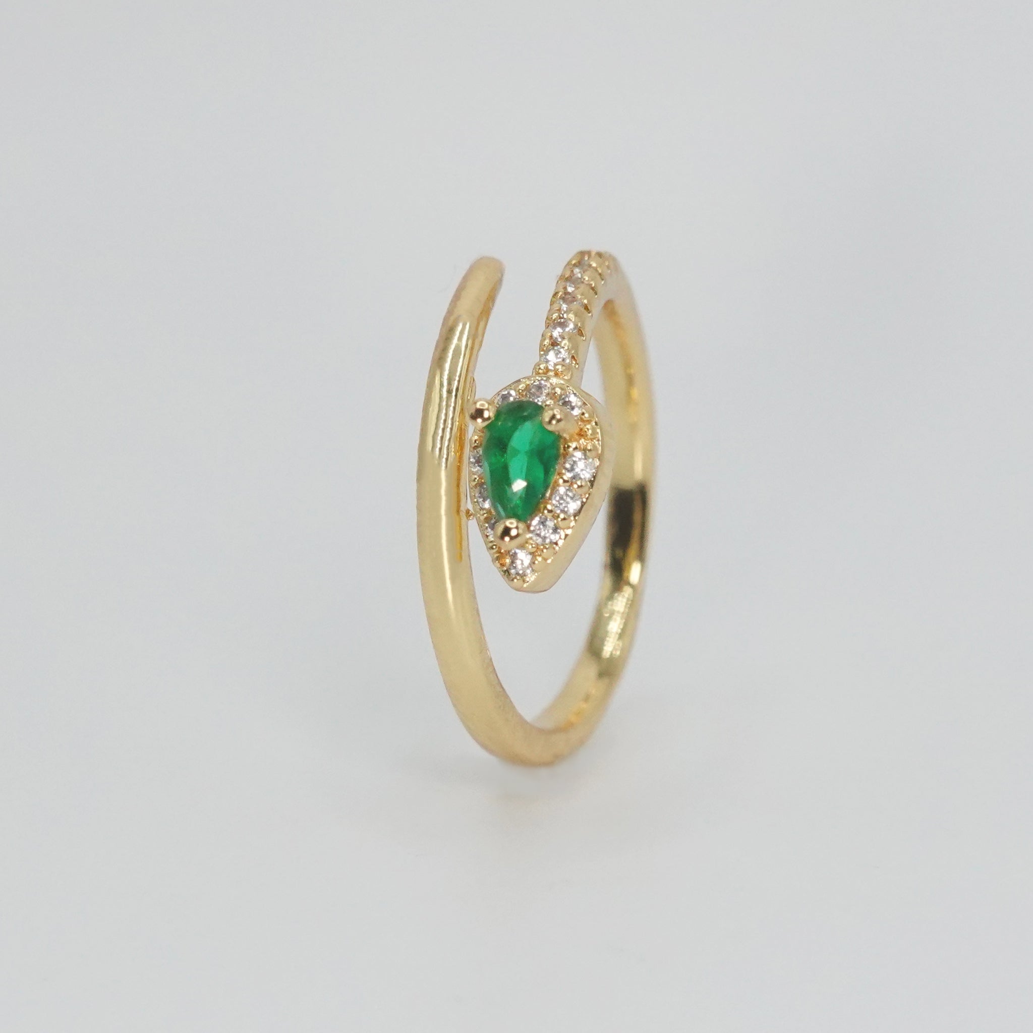 Callon Ring with snake-shaped design and stunning green gemstone, exuding mystique and sophistication.