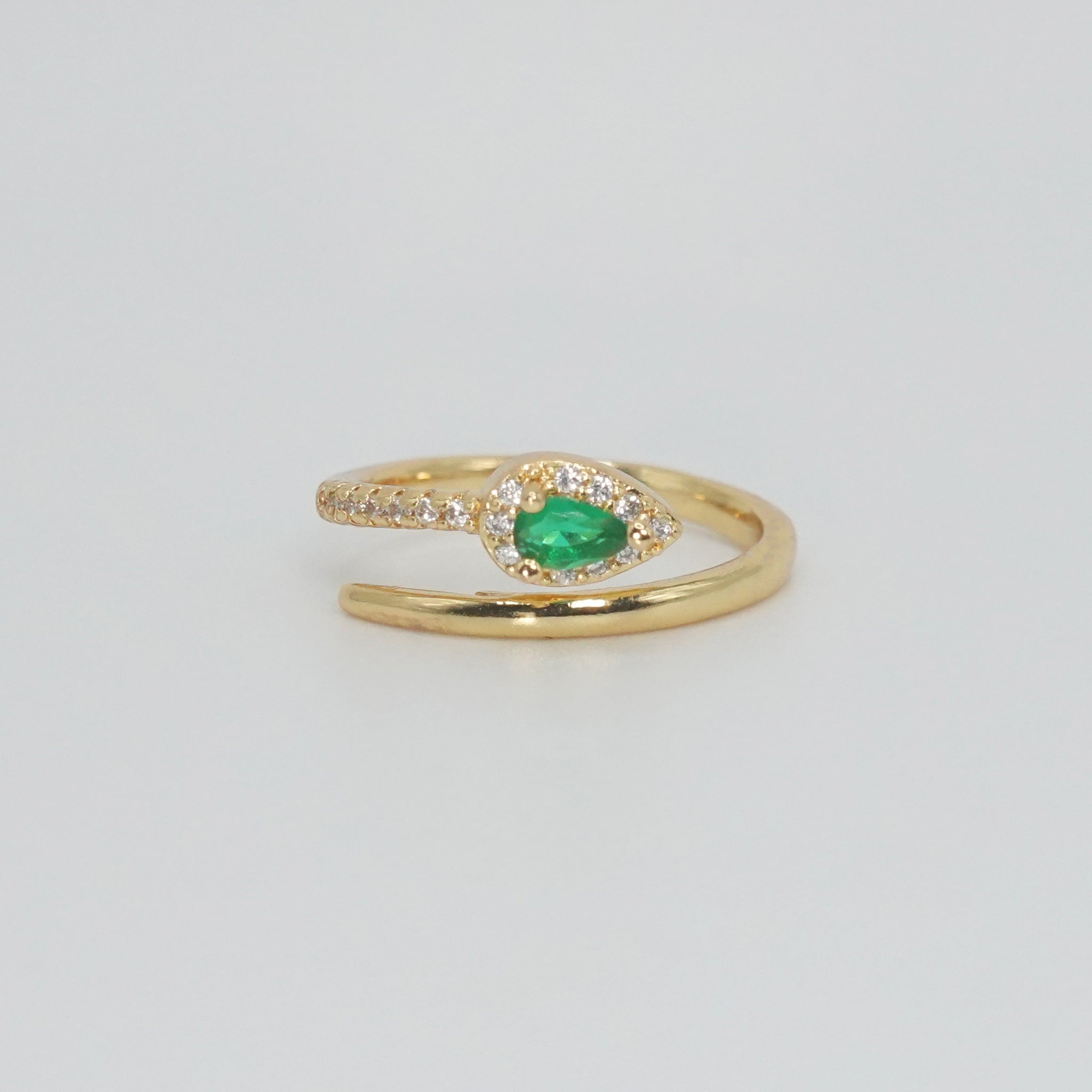Callon Ring with snake-shaped design and stunning green gemstone, exuding mystique and sophistication.