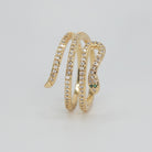 Rolling snake-shaped design with shimmering stones, epitome of elegance and mystique.