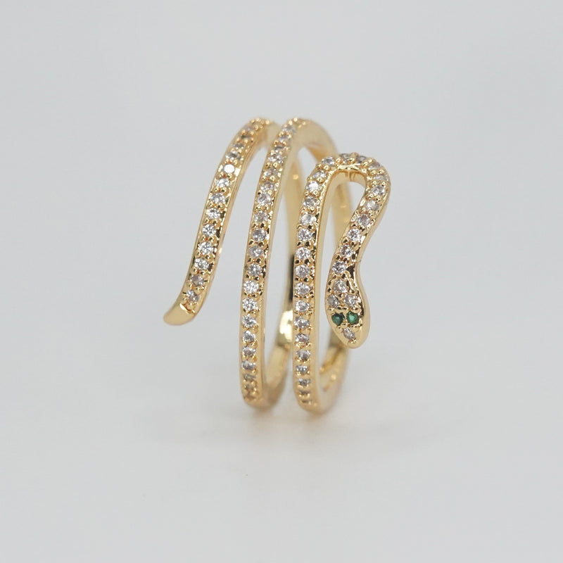 Rolling snake-shaped design with shimmering stones, epitome of elegance and mystique.