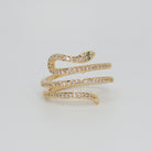 Rolling snake-shaped design with shimmering stones, epitome of elegance and mystique.