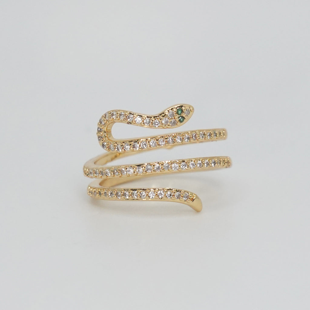 Rolling snake-shaped design with shimmering stones, epitome of elegance and mystique.