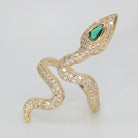 A dazzling array of shimmering stones with a captivating green gemstone at its head, epitome of sophistication.