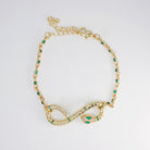 Violet Bracelet: Serpent-shaped design adorned with striking green stones, epitome of allure and sophistication.