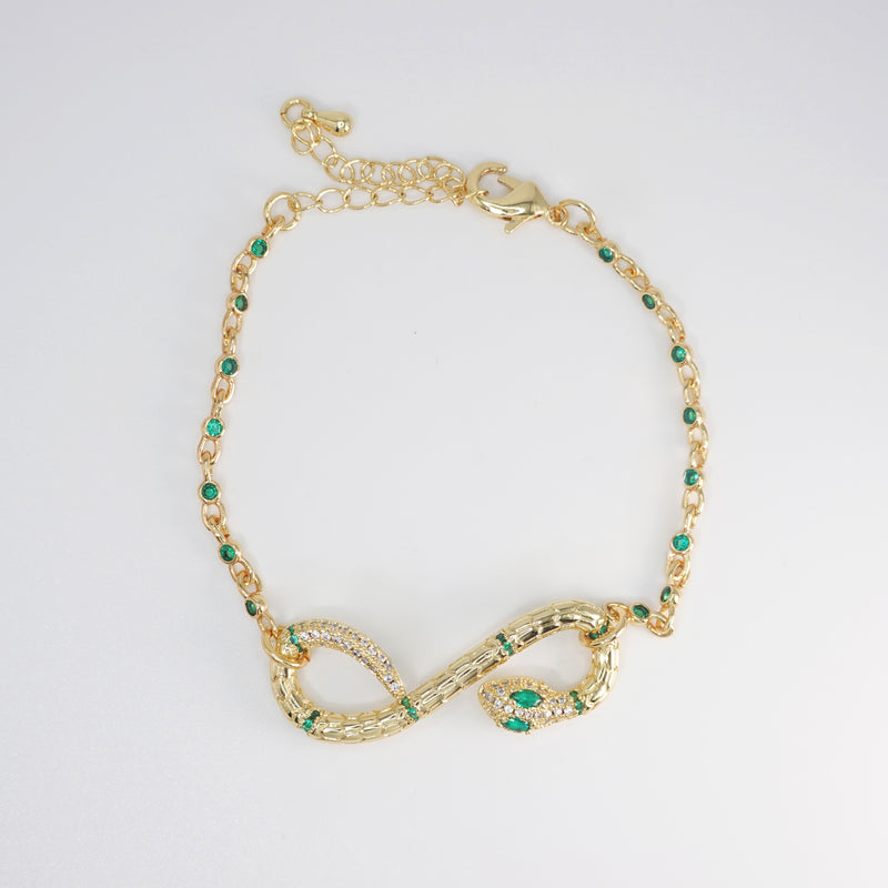 Violet Bracelet: Serpent-shaped design adorned with striking green stones, epitome of allure and sophistication.