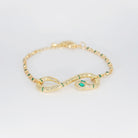 Violet Bracelet: Serpent-shaped design adorned with striking green stones, epitome of allure and sophistication.