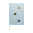 Image of the 'Ellipse Spot Journal' with a green suede cloth cover, gold geometric design, and gold ribbon bookmark.