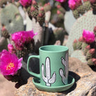 A vibrant and unique cactus-shaped coaster on a table.