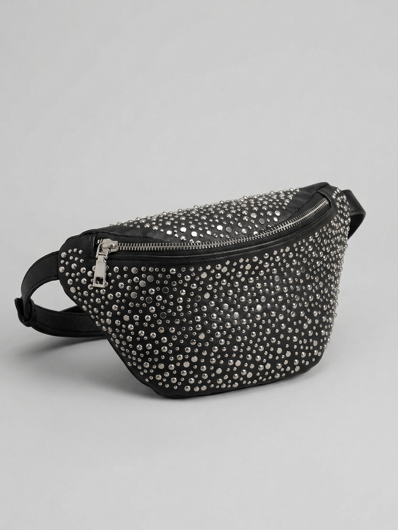Black studded belt bag on a light gray background