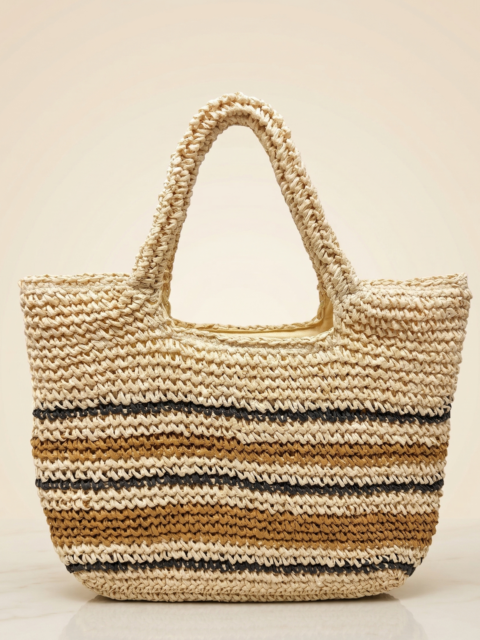 Woven straw tote bag with striped pattern on a beige background
